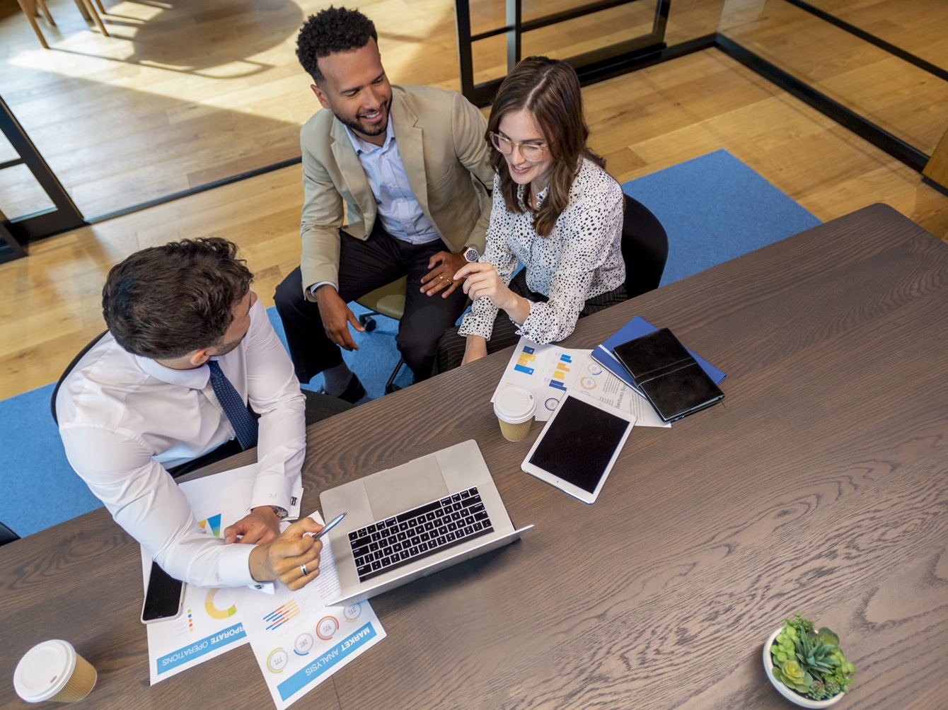 Financial advisor or lawyer with couple explaining options content-image