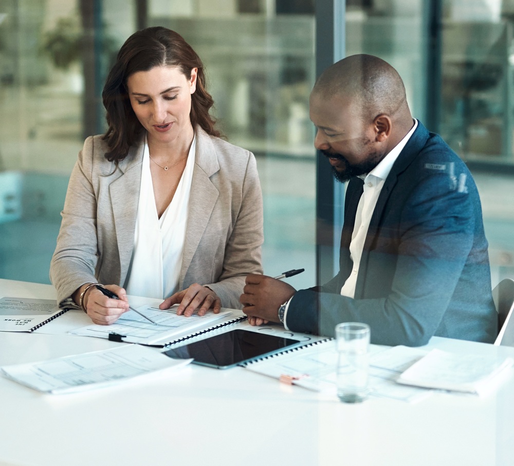 Office, meeting and documents of business people, clients or team for taxes, audit or revenue report in accounting. Paperwork, review and advice of woman, financial advisor or accountant support content-image